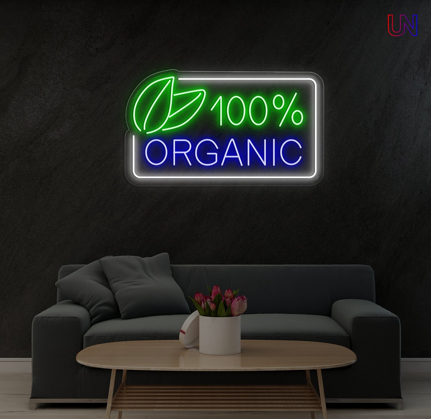 Neon sign with '100% Organic' text and leaf symbol in a living room setting.