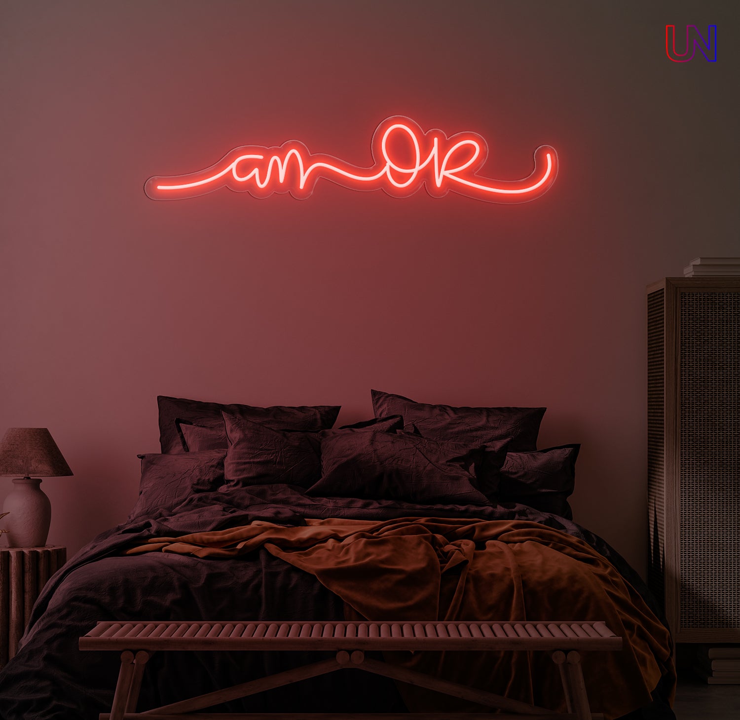 “Am Okay” handwritten-style custom neon sign glowing softly above a cozy bed setup