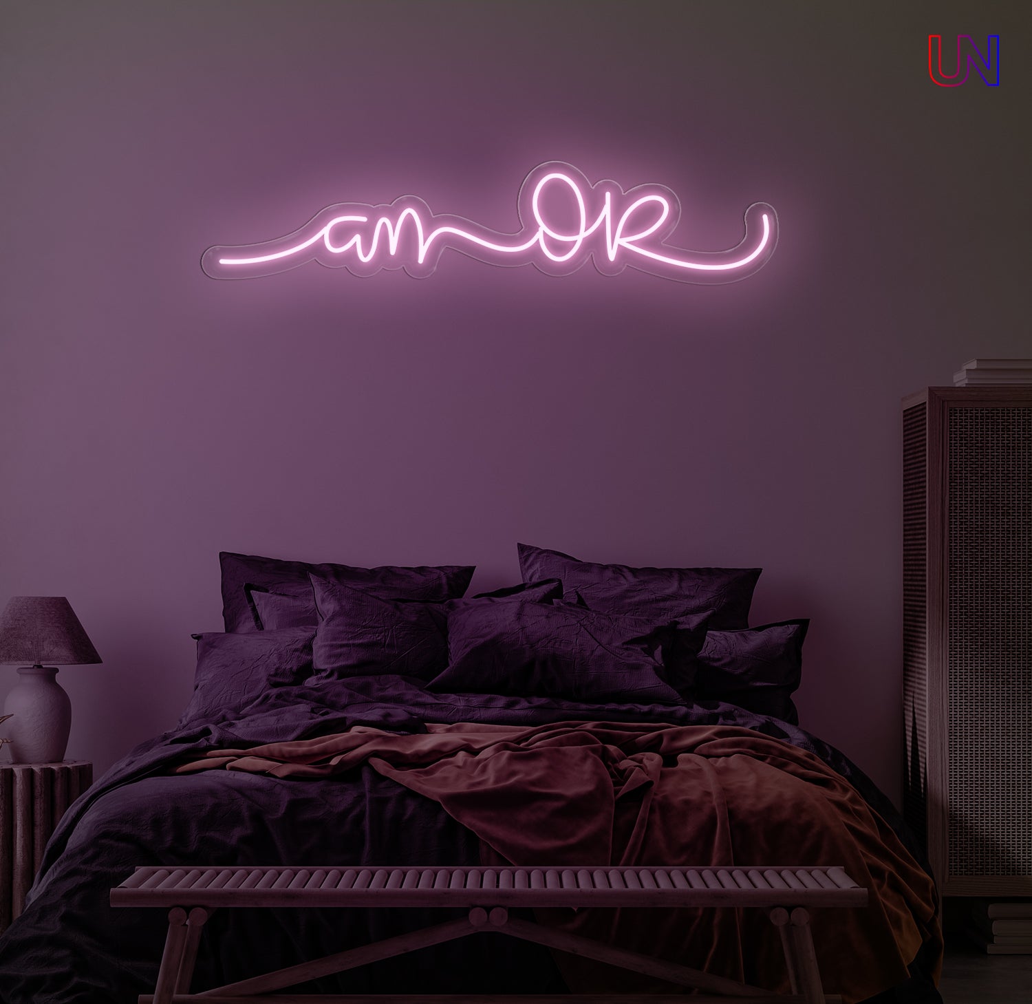 “Am Okay” handwritten-style custom neon sign glowing softly above a cozy bed setup