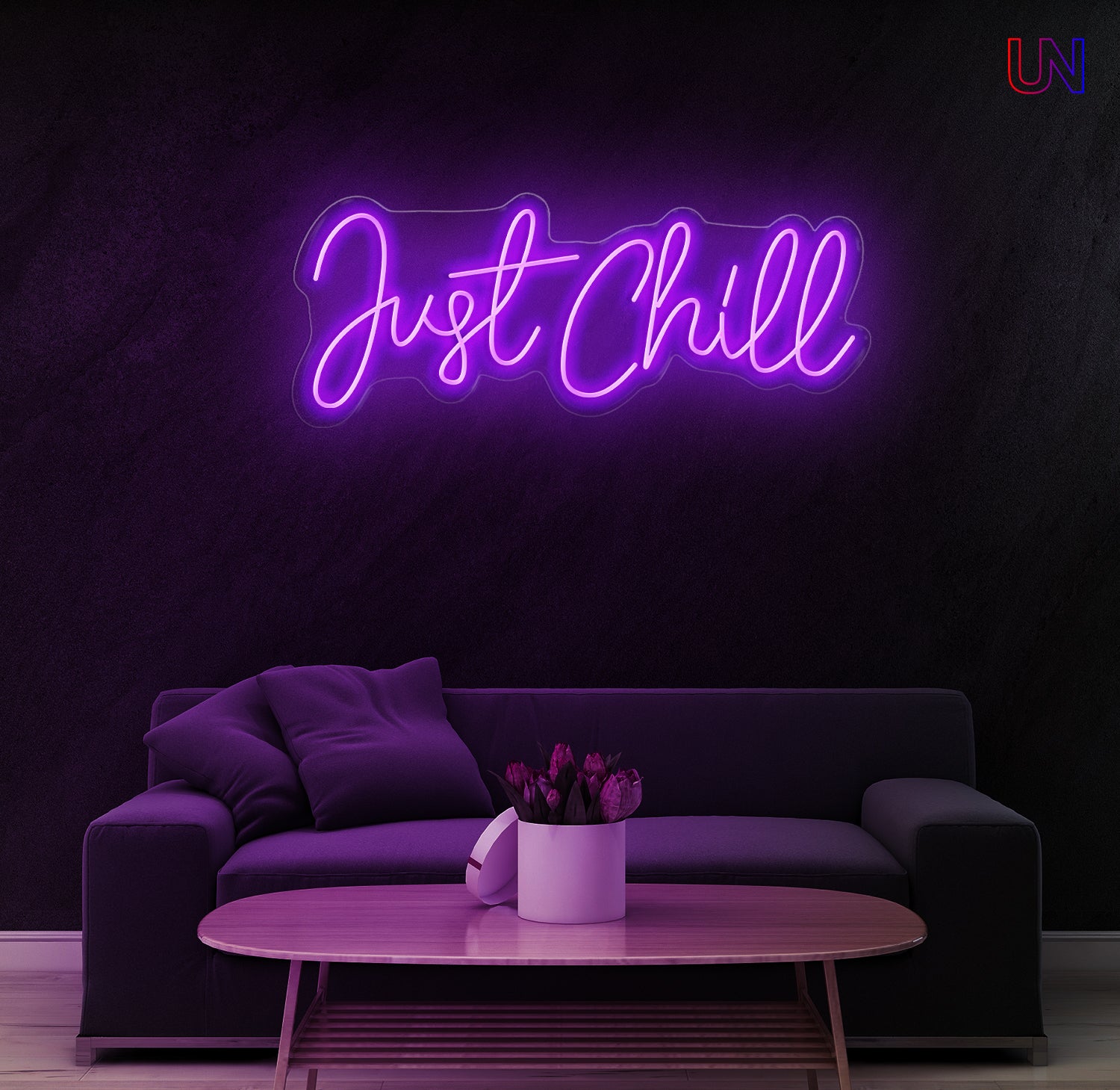 Neon sign with 'Just Chill' text in a modern living room setting.