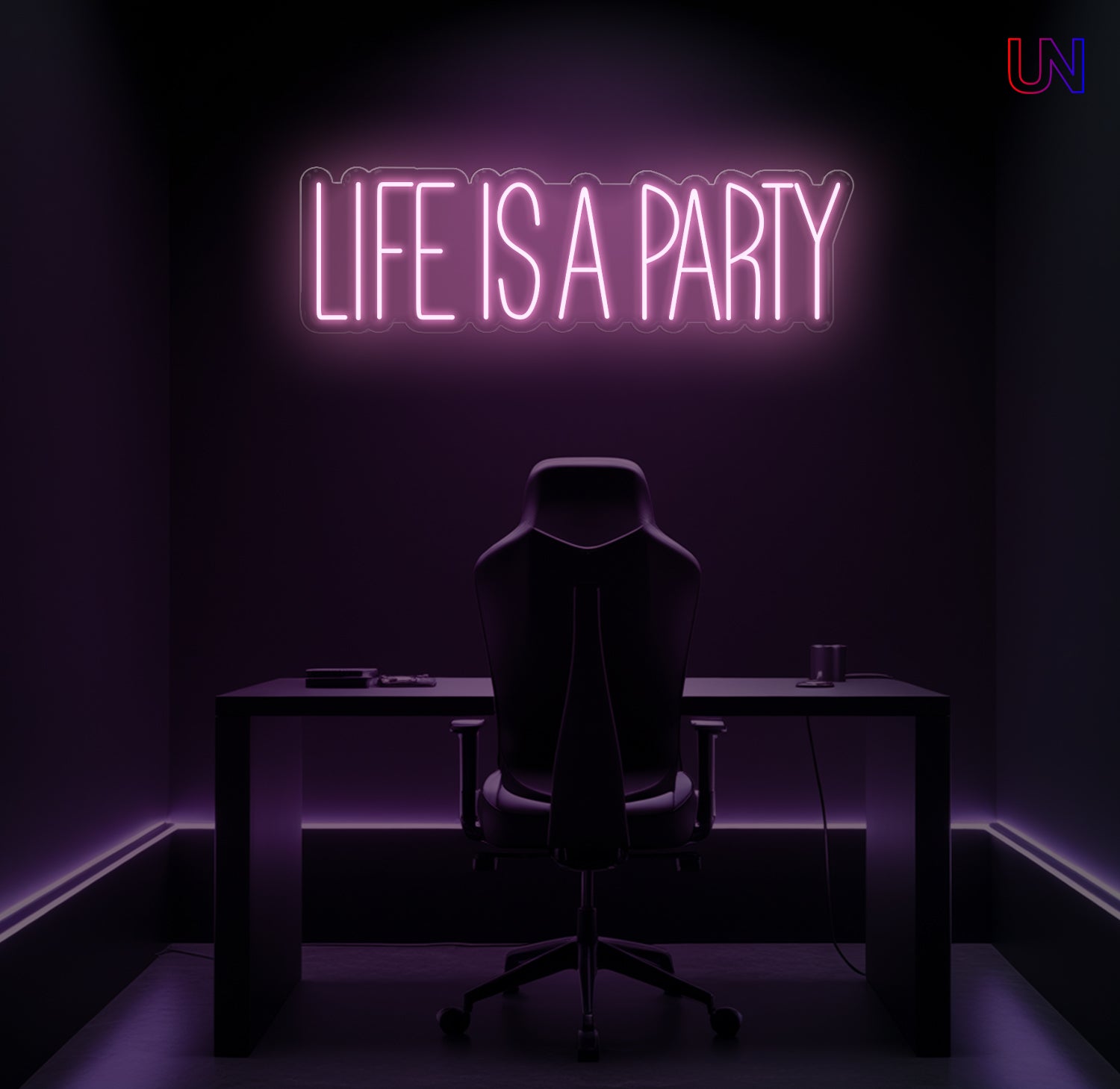 Neon sign reading 'Life is a Party' above a desk in a dark room.