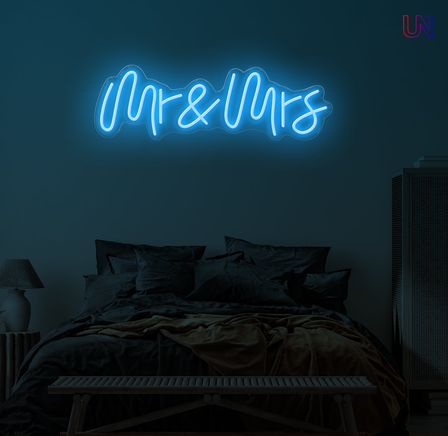 Neon sign reading 'Mr & Mrs' in a bedroom setting.