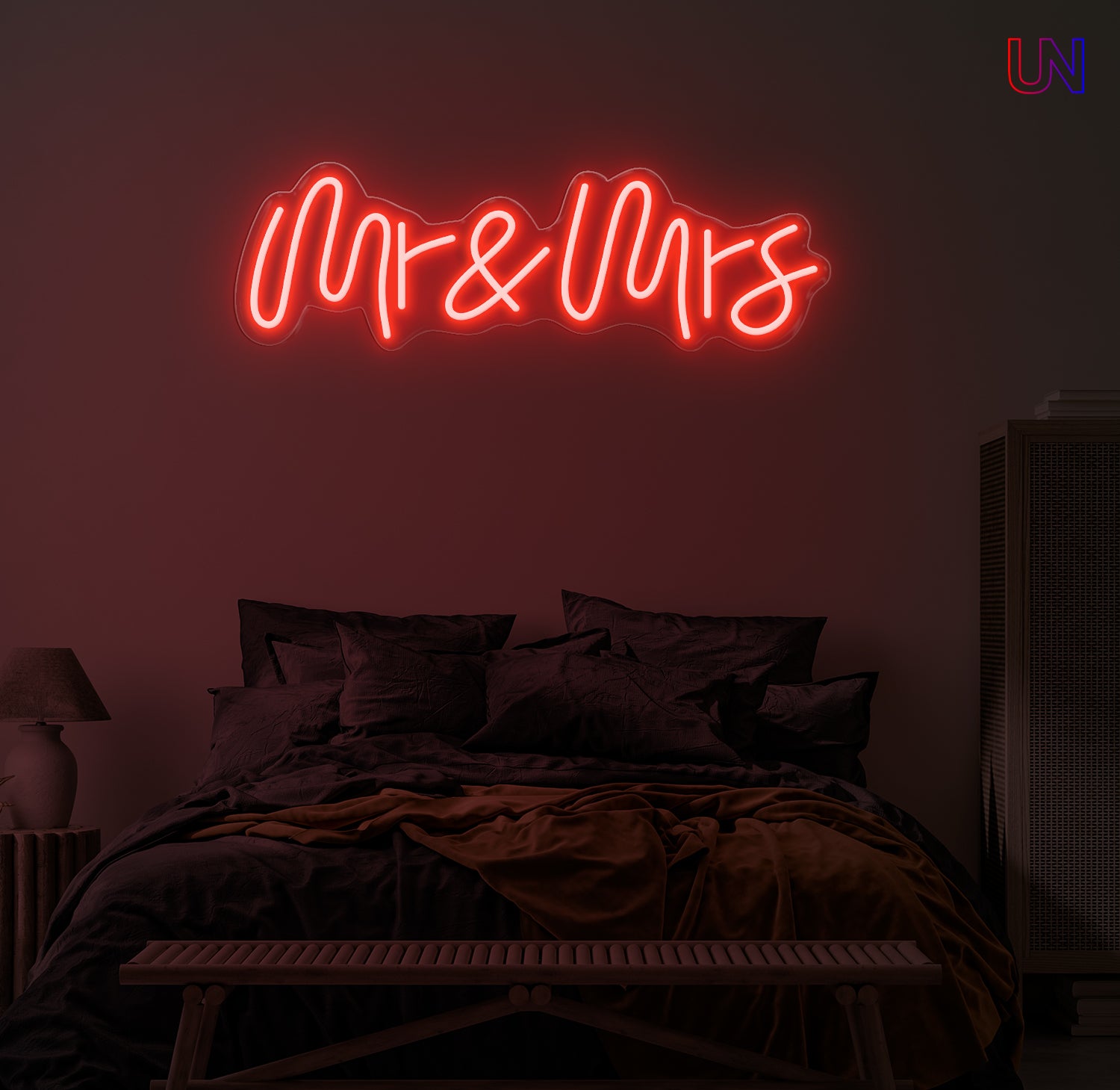 Neon sign reading 'Mr & Mrs' in a bedroom setting.