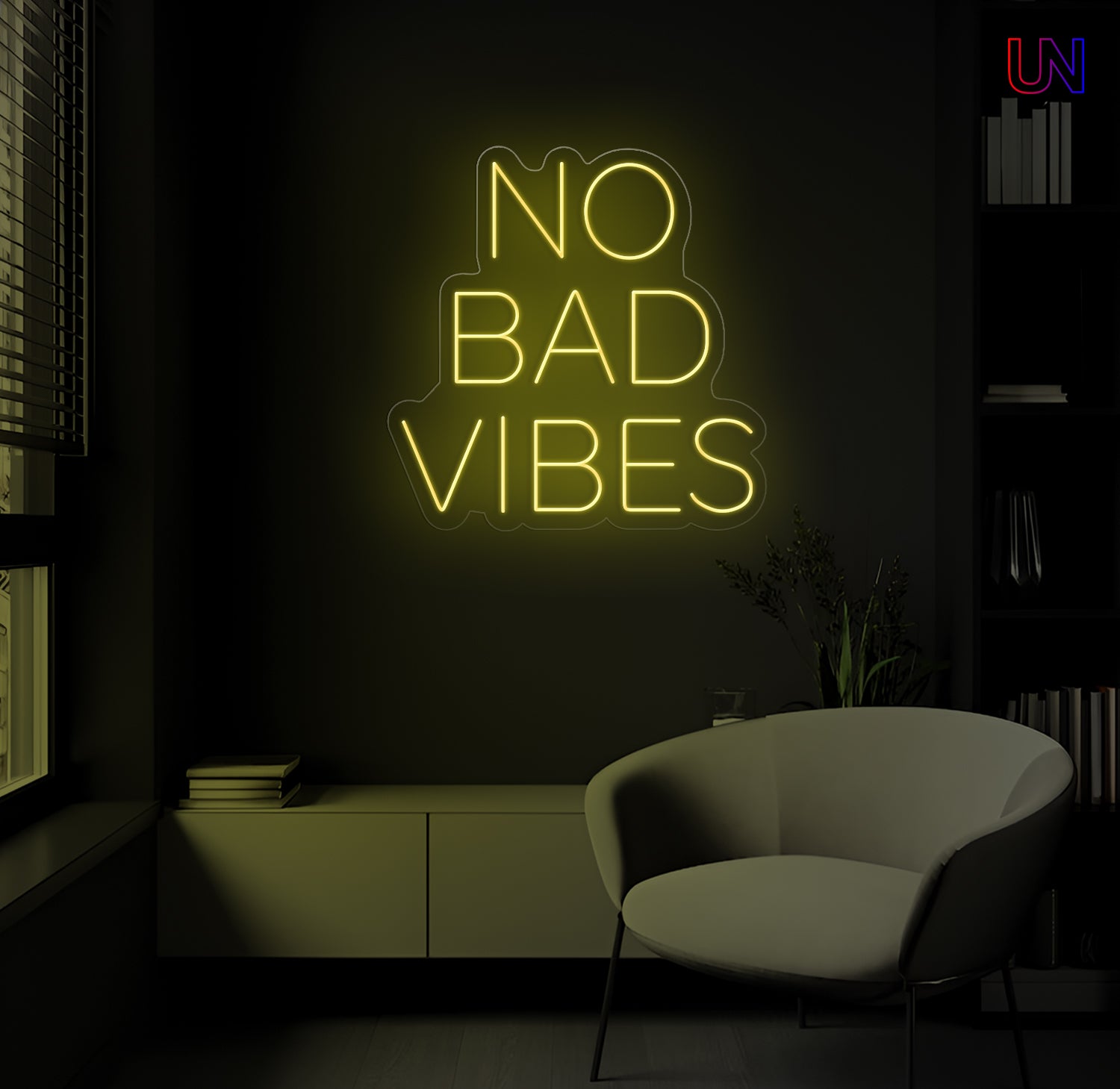 Neon sign saying 'No Bad Vibes' in a dark room with a chair.
