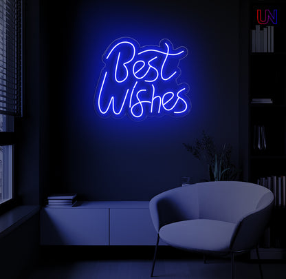 LED neon sign spelling “Best Wishes” glowing on a dark modern wall above a lounge chair