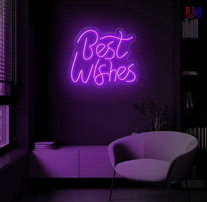 LED neon sign spelling “Best Wishes” glowing on a dark modern wall above a lounge chair