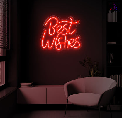 LED neon sign spelling “Best Wishes” glowing on a dark modern wall above a lounge chair