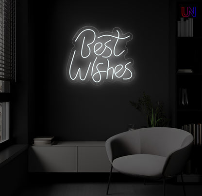 LED neon sign spelling “Best Wishes” glowing on a dark modern wall above a lounge chair