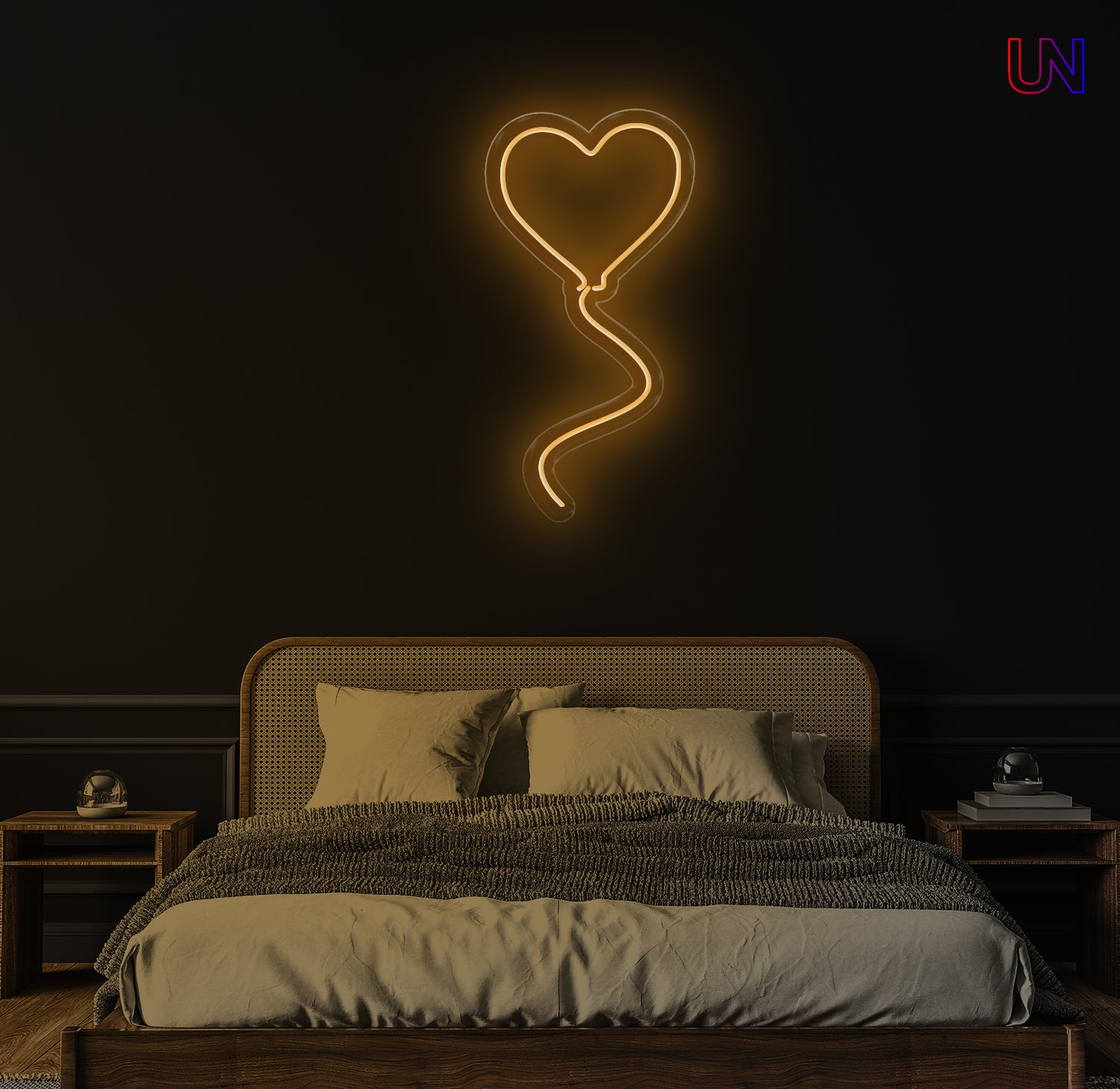 Neon heart-shaped light fixture above a bed in a dimly lit room