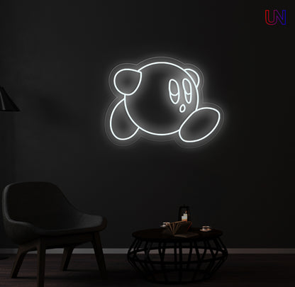 Kirby-inspired custom neon sign glowing on the wall in a modern lounge space.