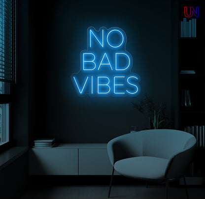 No Bad Vibes LED Neon Sign mounted on wall in modern lounge room with glowing ambient light