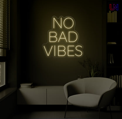 No Bad Vibes LED Neon Sign mounted on wall in modern lounge room with glowing ambient light
