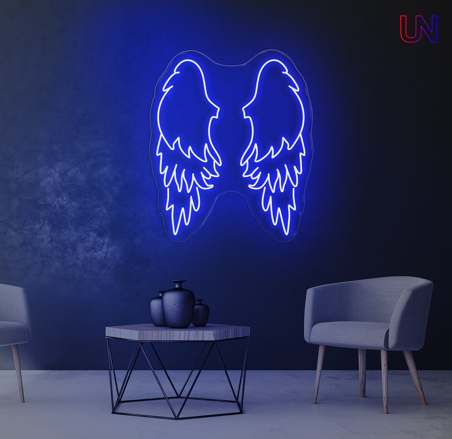 Neon sign of wings on a dark wall with a table and chairs in the foreground.